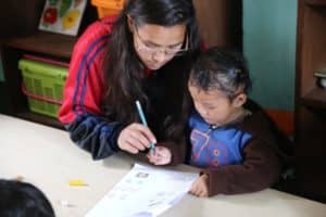 HCC Nepal Orchid Garden Girl Writing